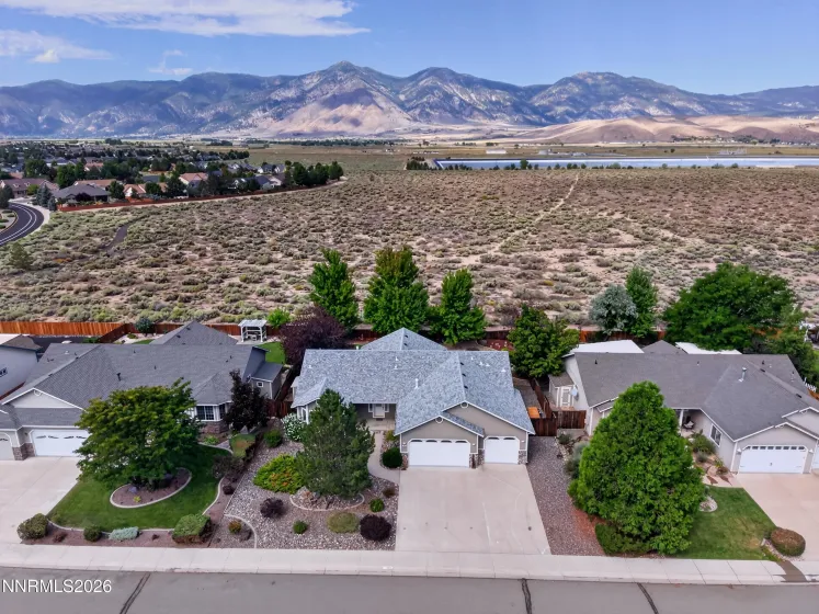 Aerial for the front of home with Sierra Nevada Mountains behind.