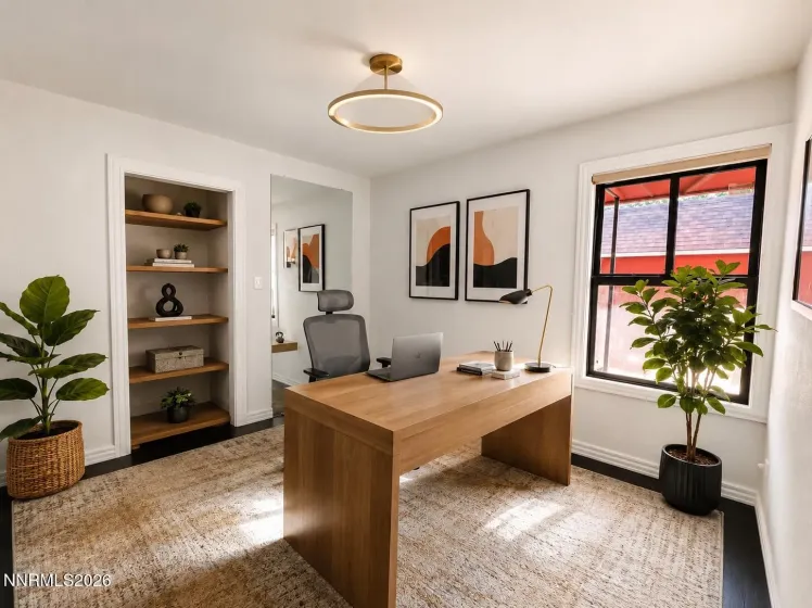 Third bedroom/gym digitally staged as an office.