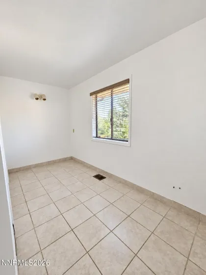 Part of the fourth bedroom