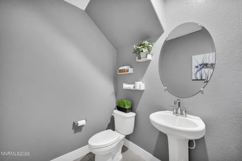 Conveniently located in a private hallway downstairs.. this spacious powder room serves the first level