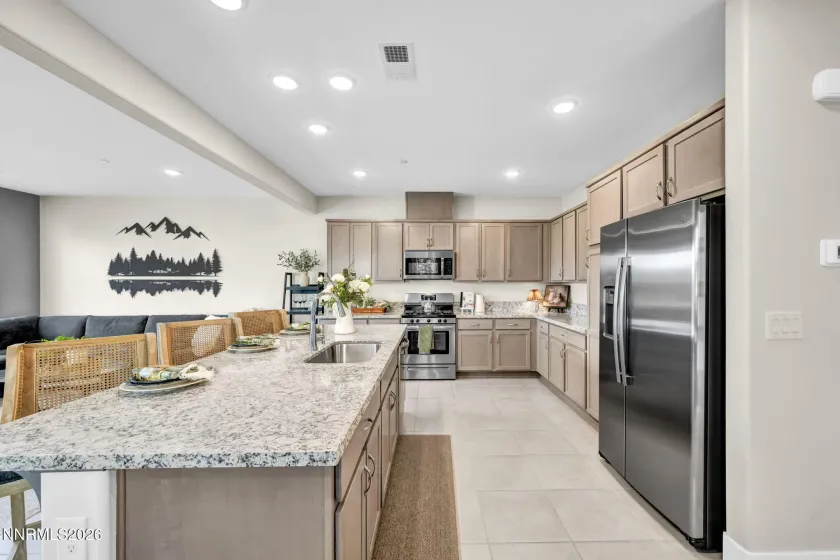 Lots of cabinetry and room for company while cooking
