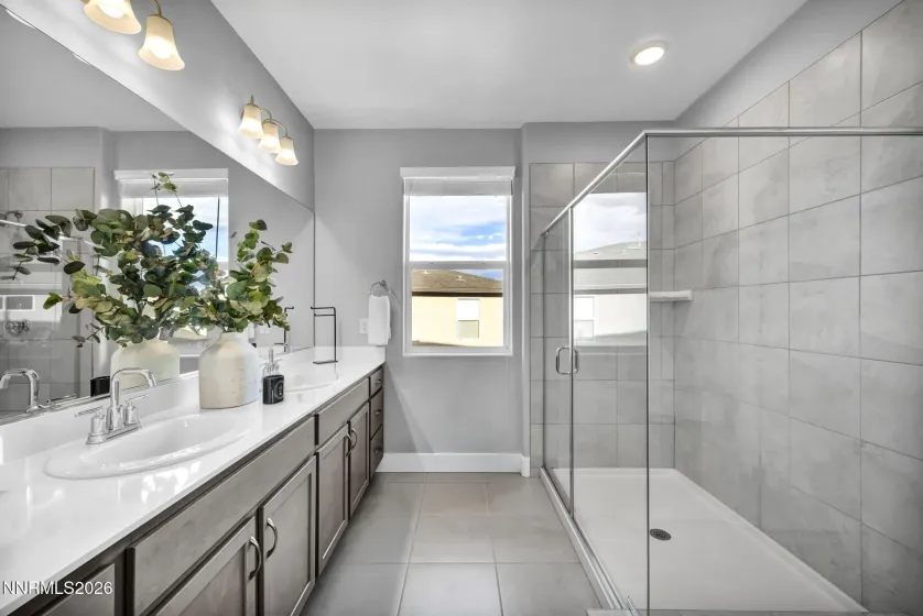 Complete with double sinks and oversized shower