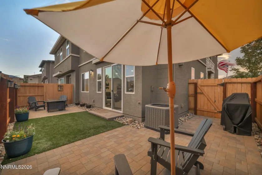 Artificial turf and paver patios create an easy-care outdoor space that’s perfect for relaxing, entertaining, and enjoying the fresh air.