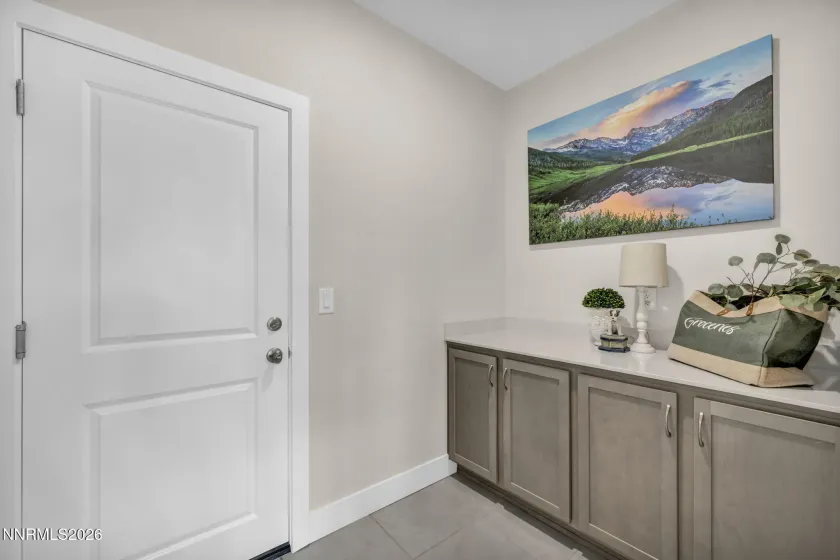 Love this space! located off the garage.. its what every home wants! a "mud room"/ storage. .you could even do custom built ins for an office.