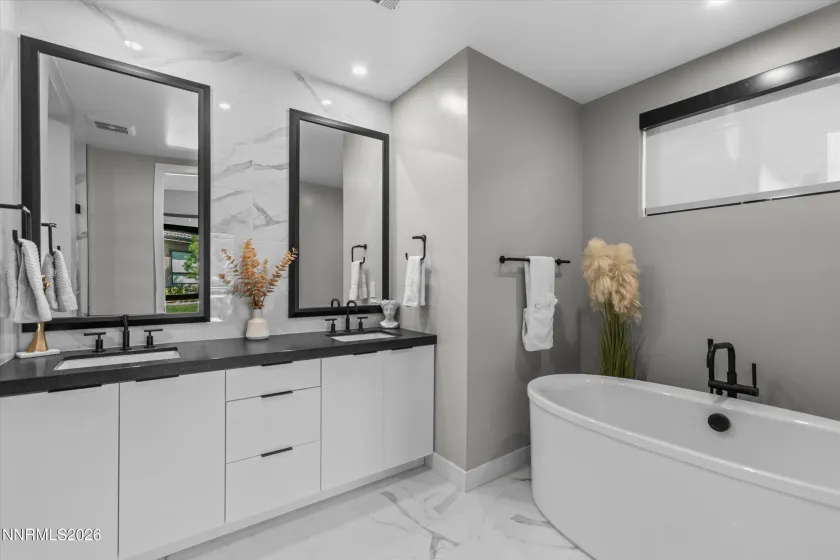 Primary bath, tub, dual sinks.