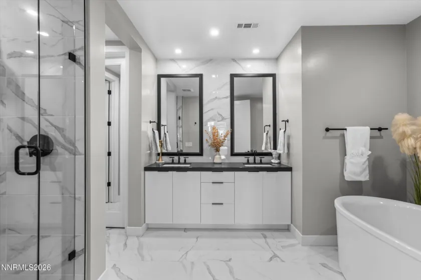 Primary suite, walk-in shower, tub.
