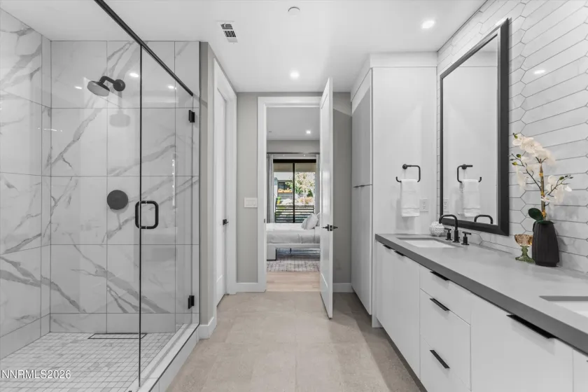Dual primary bathroom, dual sinks, walk-in shower.