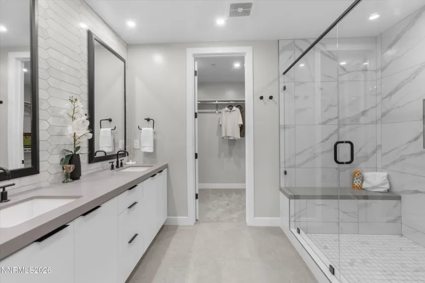 Dual primary bathroom, walk-in shower, walk-in closet.