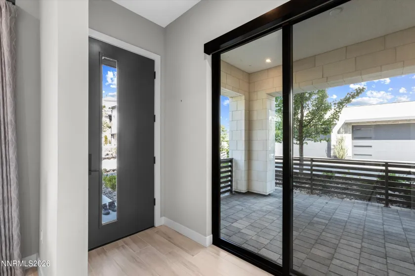 Front door, living area sliding glass door to patio.
