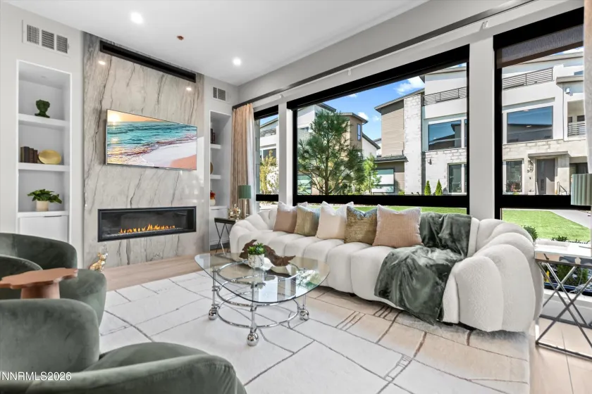Living area - west facing. Electric shades on window! Views of the Paseo.