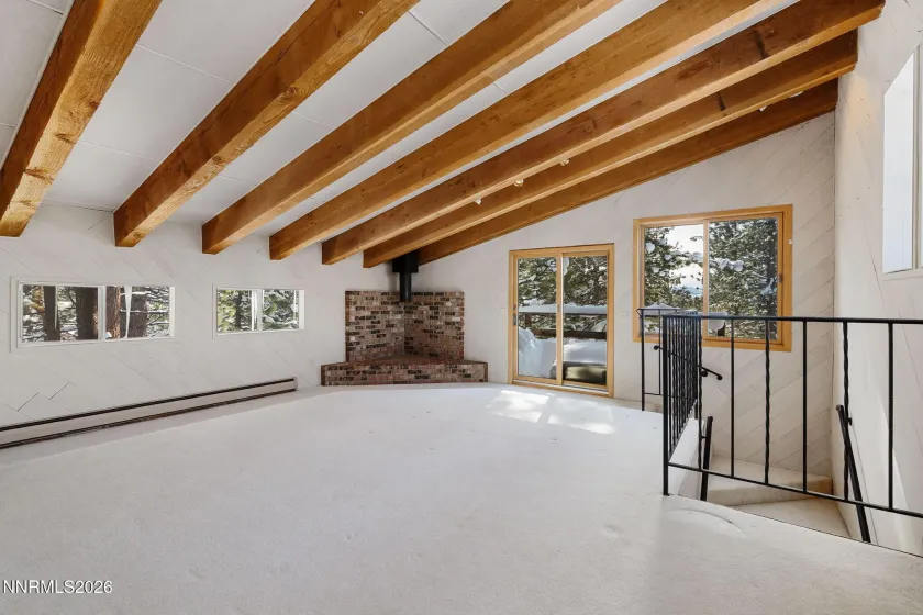 Top floor living area with upper deck.