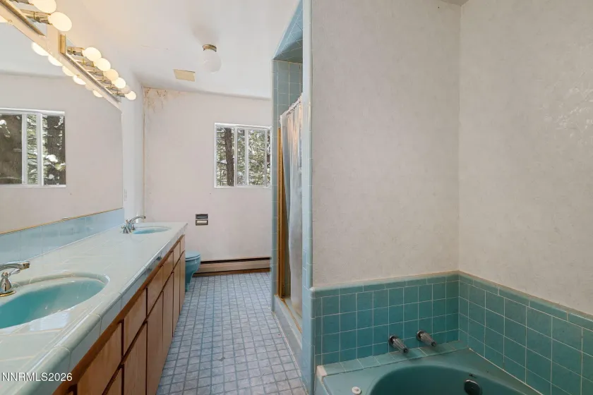 Primary bathroom with soaking tub on second floor.
