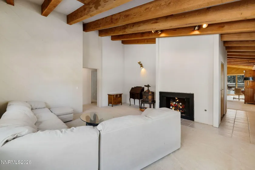 Middle floor living area with back-to-back family room fireplace.